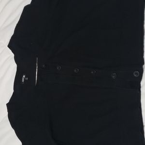 Black cardigan with buttons.